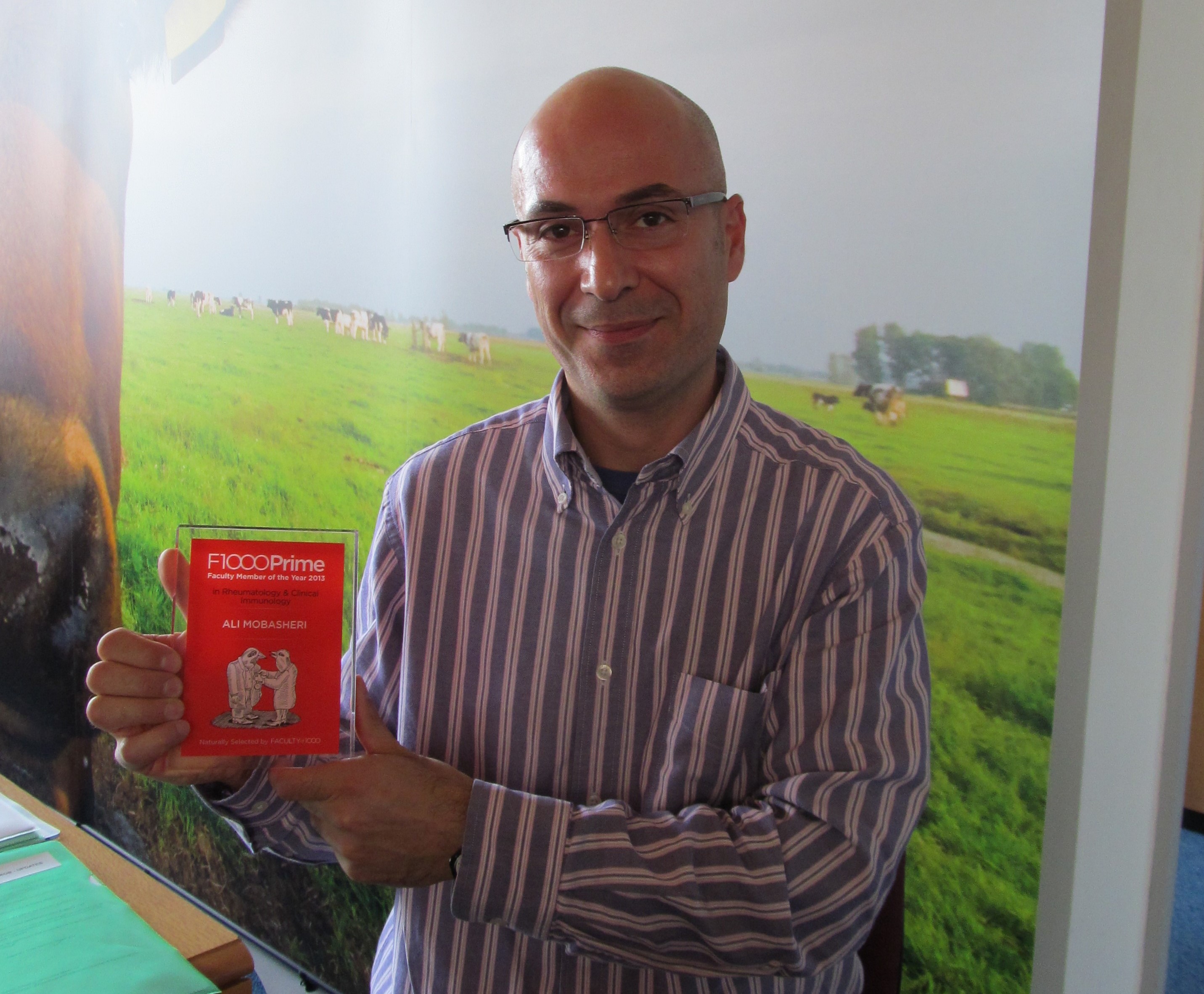 Rheumatology & Clinical Immunology Faculty Member Ali Mobasheri with his FM of the Year 2013 award plaque