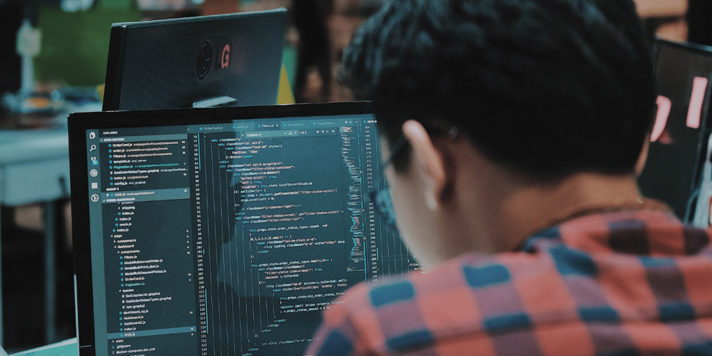A codechecker at a computer going through the codecheck workflow